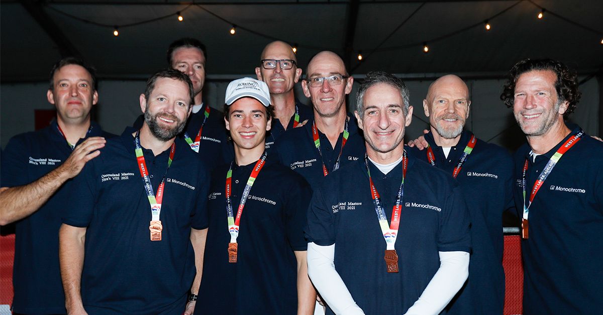 Queensland_Masters_Men’s_Eight_Rowing_Team_posing_with_their_medals.jpg